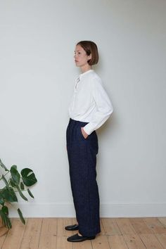 Straight leg trousers in navy herringbone from london brand cawley studio    relaxed straight leg with high waist front pleats side seam and back pockets    belt loops and  horn buttons    japanese wool linen mix    60% linen 40% wool    100% viscose lining    made in london    model is 5"11 and wears xs Cawley Studio, Layering Jacket, London Models, London Brands, Favorite Daughter, Trouser Pants Women, Straight Leg Trousers, Knit Pants, Designer Outfits Woman