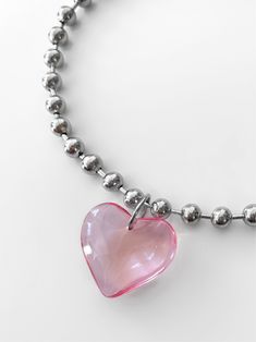 Let this piece do all the talking for you! Meet the limited edition 'LIA' necklace - from a stunning glass heart pendant to stainless steel ball chain, this piece will easily add the perfect touch to any outfit. Trust us, compliments are waiting! ♥ Made with a large pink glass heart pendant and stainless steel ball chain ♥ Waterproof & rust-free ♥ This is a limited edition drop! When these babies sell out, it's forever Available in lengths 14", 15", 16", 18", 20". Model is wearing 14". Handmade Heart Shaped Ball Chain Necklace For Gift, Heart-shaped Ball Chain Necklace Gift, Valentine's Day Gift Ball Chain Necklace, Heart Shaped Ball Chain Necklace For Valentine's Day, Heart-shaped Ball Chain Necklace For Valentine's Day, Trendy Ball Chain Necklace For Gift, Trendy Ball Chain Necklace As Gift, Trendy Pink Sterling Silver Necklaces, Trendy Pink Sterling Silver Necklace