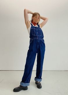 American vintage dark wash denim long overalls in a rare smaller size, contrast white stitching in a lovely medium weight denim. Straight leg cut with adjustable straps. Originally these are a men's cut but suit a female body also ( seen in pictures ).  Please see measurements if unsure.  Excellent throw on piece for the in between seasons. great on any gender. Brand ~ Roebucks Size ~  women's AU 8-10 / Men's small  Material ~ medium weight denim  Measurements : waist ~ 41.5 cms hips ~ 51 cms  i Dark Wash Utility Denim Jumpsuit With Bib Front, Utility Style Dark Wash Denim Jumpsuit With Bib Front, Retro Dark Wash Cotton Denim Jumpsuit, Vintage Dark Wash Cotton Denim Jumpsuit, Retro Dark Wash Denim Jumpsuit, Vintage Dark Wash Bib Front Overalls, Vintage Denim Blue Bib Front Overalls, Vintage Dark Wash Overalls With Pockets, Retro Denim Bib Front Jumpsuit