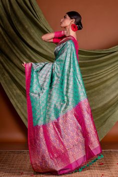 This is pure silk handloom tanchoi banarasi with pink  border pallu. The green color body and pink border and pallu adds extra royalness in it. Green Banarasi Silk Saree With Meenakari, Green Traditional Wear With Zari Weaving In Paithani Silk, Green Paithani Silk Traditional Wear With Zari Weaving, Green Banarasi Silk Dupatta With Meenakari, Green Meenakari Tussar Silk Saree, Green Tussar Silk Saree With Meenakari, Green Meenakari Dupatta Traditional Drape, Green Paithani Silk Dupatta With Meenakari, Green Meenakari Paithani Silk Dupatta