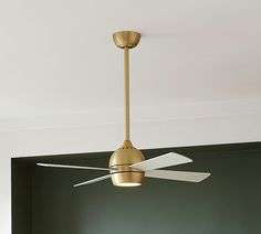 a ceiling fan with two white blades hanging from it's center point in a room