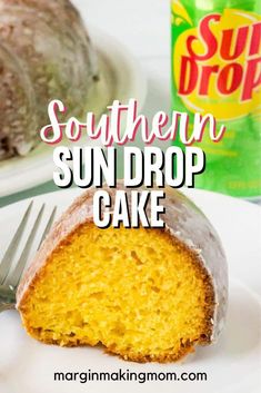 a piece of cake sitting on top of a white plate next to a can of sun drop