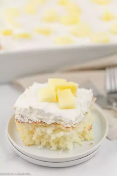 a piece of cake sitting on top of a white plate next to a knife and fork