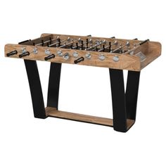 a wooden foosball table with black legs and silver knobs on it's sides