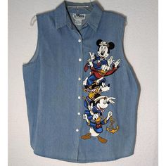 Vintage Mickey Unlimited Jerry Leigh Womans Sz Large Mickey Denim Sleeveless Screenprint Shirt From The 90s Nos. Matching Pants Sold Separately In Our Store. Featuring Minnie, Mickey, Goofy, Daisy & Donald In Sailor Style Outfits. This Shirt Has Some Discoloration On The Back Side, Which We Think Was Caused By Being Packed In A Cardboard Box For A Long Time. Casual Blue Denim Tank Top, Retro Blue Cotton Denim Vest, Blue Retro Cotton Denim Vest, Blue Cotton Retro Denim Vest, Casual Sleeveless Blue Shirt, Denim Blue Cotton Tank Top, Casual Denim Blue Cotton Tank Top, Casual Cotton Denim Blue Tank Top, Casual Medium Wash Sleeveless Top