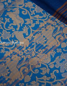 A Beautiful Blue Pure Cotton Vanasingaram Border Saree. The saree features a plain body with an elegant stiped pallu. The border on the bottom has a thread woven Vanasingaram pattern. Fall and pico are done. Does NOT come with blouse fabric.  Condition : New Fabric : Pure Cotton Blouse : No blouse fabric. Fall / Pico : Fall and pico are done. Washing : Dry clean only Occasion : Traditional, Religious , Festival, Special occasion, Party wear Note: We try to stay as accurate to the original colors Blue Bohemian Blouse With Zari Weaving, Bohemian Blue Blouse With Zari Weaving, Bohemian Handloom Pre-draped Saree For Wedding, Blue Traditional Patterns Blouse Piece For Puja, Blue Bohemian Handloom Blouse Piece, Bohemian Blue Handloom Blouse Piece, Blue Traditional Blouse Piece For Puja, Blue Blouse Piece With Traditional Patterns For Puja, Bohemian Blue Saree With Traditional Patterns