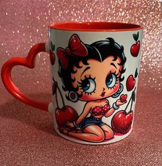 If you are looking for the perfect gift for a Betty boop fan, look no further! These mugs are customized  in  design shown using UVDTF and color heart handle mug as shown.  Each mug holds a beverage up to 11 ounces. Mug Details Material: High quality ceramic & high gloss finish Grade: AAA (highest grade possible) Color: Varies Style: 11 fluid oz Product Care Instructions: Hand Wash Only Item Weight: 12.5 oz Product Dimensions: 3.7 x 3.2 inches Color Heart, Colorful Heart, High Gloss Finish, Betty Boop, Design Show, Red Heart, High Gloss, Drinkware, Barware