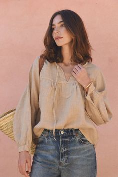 Style // The perfect faded brown linen blouse that gets better with age Your new go-to top, the Meadow Blouse, a whimsical silhouette featuring a flowy casual style, with flutter sleeves and a slightly oversized fit to add the perfect shape to any look. A slight V front, tassels and cuffed sleeves make the Meadow Blouse unique and fun, for a laid back and effortless approach to dressing, can be paired with a pair of jeans of linen pants Fabric Note // Made in Italy from 100% Linen Sizing Advice Long Sleeve Linen Peasant Top For Spring, Brown Linen Long Sleeve Blouse, Beige Relaxed Blouse For Spring, Spring Bohemian Linen Blouse, Chic Linen Peasant Top For Spring, Summer Linen Peasant Top With Relaxed Fit, Beige Flax Long Sleeve Top, Spring Linen Blouse For Casual Gatherings, Beige Long Sleeve Flax Top