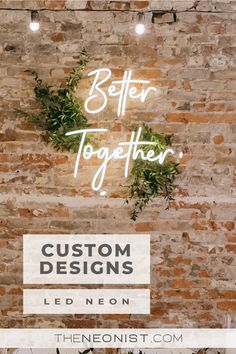 a brick wall with the words'better together'in white lettering and greenery