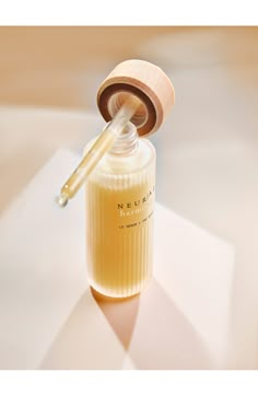 What it is: A reharmonizing serum that helps restore the skin's balance and supports its resilience.What it does: Day after day, your features look less rigid and more expressive. The first step in the NEUR|AÉ routine, the serum complements the creams (sold separately) for results you can see and feel. NEUR|AÉ is a new skin-care brand inspired by neuroscience, which shows that our emotions have an impact on our features over time. It aims to address this impact and enhance skin wellness. Its eff Skin Care Products Photography, Serum Photography Products, Skin Serum Photography, Minimal Skincare Photography, Skincare Shoot Product Photography, Luxury Skincare Product Photography, Face Serum Product Photography, Product Staging, Skincare Products Photography