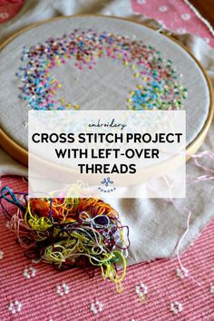 a cross stitch project with sprinkles and thread