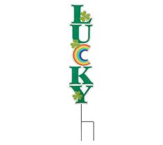 a metal sign that says lucky with shamrocks on the top and rainbow in the middle