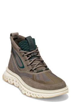 Designed for adventure and comfortable strides, this water-resistant chukka features signature foam cushioning underfoot and a flexible grooved sole. Water-resistant Lace-up style ZERØGRAND cushioned footbed Leather and textile upper/textile lining/rubber sole Imported Casual Khaki Lace-up Waterproof Boots, Casual Green Hiking Boots With Boost Midsole, Green Sneakers With Textured Sole For Outdoor Activities, Casual Green Waterproof Boots, Casual Green Low-top Waterproof Boots, Green Sporty Walking Boots, Sporty Green Walking Boots, Green High-top Waterproof Boots With Vibram Sole, Casual Khaki Waterproof Boots For Outdoor Activities