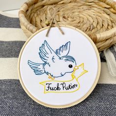 Funny stitched embroidery hoop art with the words “Fuck Putin” and a blue bird Ukraine Embroidery, F Off, Stand With Ukraine, Hoop Art, Gifts For Coworkers, Embroidery Hoop