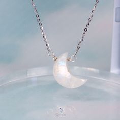 This elegant crescent moon pendant necklace features a crescent moon shape moonstone with blue flash, on solid 925 sterling silver cable chain and platinum plating. Add this elegant crescent moon moonstone pendant necklace to your everyday fine jewelry collection or as gift for your loved ones. Pendant dimensions: 0.68 x 0.48 inNecklace length: 17.5 in with the adjustable ballMaterials: moonstone, 925 sterling silver Jewelry Care: See more information about how to care for your jewelry here. Shipping Policy: Orders will be shipped within 1-3 business days. Economy shipping will take 7-14 days to arrive and standard shipping is 1- 4 days for U.S. orders. International shipping time is depended on the country and per shipping method. Shipping cost will be calculated at check out.For more det Crescent Moon Necklace Silver, Moonstone Pendant Necklace, Crescent Moon Pendant, Moon Pendant Necklace, Moon Shape, Crescent Moon Necklace, Moon Goddess, Silver Moon, Moonstone Pendant