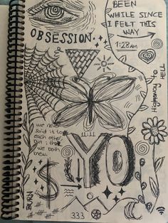 a notebook with an image of a butterfly and the word oy written on it