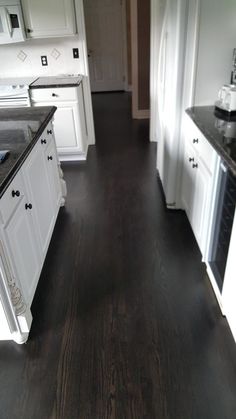 the kitchen is clean and ready to be used for cooking or cleaning up with new flooring