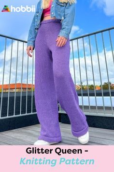 a woman in purple pants and denim jacket posing for the camera with her hands on her hips