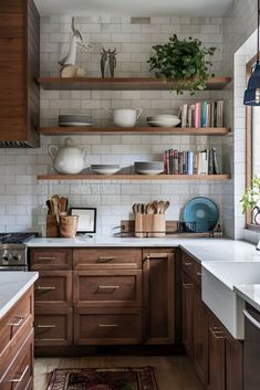 a kitchen with wooden cabinets and white tile backsplash, open shelving above the sink