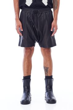 A unisex staple, JONNY COTA's new Drop Crotch Leather Shorts are handcrafted from luxe leather cut in a modern drop crotch silhouette. Wide elasticized waistband with cotton drawstring Backslash pocket 100% sheepskin leather 100% lining polyester Care instructions: Specialty cleanSIZE + FIT Loose, drop crotch fit Fits true to size Leather Bottoms For Spring Streetwear, Spring Leather Bottoms For Streetwear, Casual Black Leather Shorts, Summer Leather Bottoms With Built-in Shorts, Black Leather Bottoms With Built-in Shorts, Leather Cuts, Leather Shorts, Jewelry Sales, Jumpsuit Dress