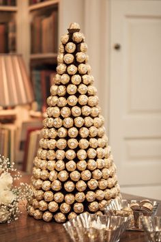 a christmas tree made out of wine corks on top of a table with other items