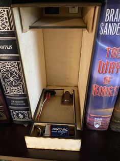 an open drawer with some books on it