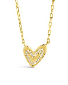 Show your love with this Mabel CZ Heart Pendant Necklace! It's the perfect gift for adding a dazzling touch of sparkle to any special occasion. Crafted with a real cubic zirconia gemstone and shaped into an adorable heart, this dazzling piece will make your special someone feel truly treasured. ❤️ Materials: 14K gold plated sterling silver or sterling silver, cubic zirconia Features: Measures 16" with 2" extender, 0.45" pendant, 1mm chain, Lead & Nickel free, lobster clasp Valentine's Day Cubic Zirconia Heart Necklace, Cubic Zirconia Heart Pendant Necklace With Sparkling Stones, Heart-shaped Diamond Necklace With Heart Charm For Valentine's Day, Heart-shaped Yellow Gold Cubic Zirconia Diamond Necklace, Heart-shaped Yellow Gold Cubic Zirconia Necklace, Heart-shaped Diamond Necklace For Gift, Yellow Gold Heart-shaped Cubic Zirconia Diamond Necklace, Heart-shaped Cubic Zirconia Diamond Necklace In Yellow Gold, Diamond Heart Charm Necklaces