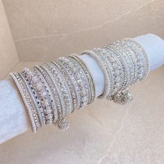 2 Stunning stacks of luxurious silver bangles with with our silver daisy bangles and finished with the prettiest pearl & faux kundan jhumka drop bangle.  Perfect for reception brides or those wanting to make a statement. Ready to Ship! White Bangles, Bridal Survival Kit, Kundan Jhumka, Reception Bride, Bangle Box, Bridal Choker, Fancy Jewellery Designs, Kundan Set, Bridal Necklace Set