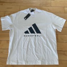 New With Tags, Mens Size Medium. Thick Knit Short Sleeve Adidas Basketball Logo T-Shirt. Wide High Collar, Black And White. White Adidas Logo Crew Neck T-shirt, White Adidas Graphic Tee With Logo, White Adidas Logo Casual Tops, White Adidas Logo Top For Streetwear, White Adidas T-shirt For Streetwear, Adidas Logo White Tops For Streetwear, White Adidas Graphic Tee, Adidas White T-shirt For Streetwear, White Casual Adidas Logo Tops