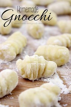 homemade gnocchini on a cutting board with powdered sugar