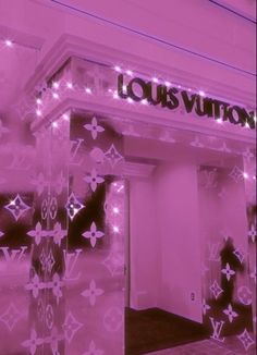 the louis vuitton store front is covered in pink lights and decorated with stars