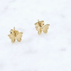 14kt gold filled butterfly stud earrings .2 inches Jewelry Care: Clean with a soft cloth and store in a jewelry bag. 14k Gold Butterfly Charm Earrings, 14k Gold Butterfly Earrings With Butterfly Charm, 14k Gold Butterfly Earrings With Charm, 14k Gold Butterfly Earrings For Gift, Small Gold Earrings For Gift, Gold Earrings For Gift, Dainty Yellow Gold Earrings With Butterfly Charm, 14k Yellow Gold Earrings With Butterfly Charm, Elegant Butterfly Earrings For Everyday Wear