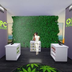 a woman sitting on a chair in front of a green wall