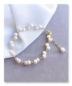 "This bracelet is dainty and elegant. It's perfect for daily wear adding a unique sense to any outfit. It is also a wonderful gift for your family, flower girl, bridesmaids, or best friends. 🤍 Packaging: All jewelry comes in a beautiful and careful packaging. If the item is going directly to the gift recipient please leave us a note during checkout so we don't include the invoice. Material: - Fresh water pearl 5-5.5 mm - 14k gold-plated spacer 2.5mm - 14K gold-plated chain - 14k gold-plated spr Resizable Jewelry For Mother's Day, Elegant Resizable Pearl Bracelet, Pearl White Jewelry Bracelet For Gift, Elegant Resizable Bracelet For Formal Occasions, Elegant Hypoallergenic Jewelry For Mother's Day, Dainty Resizable Wedding Jewelry, Elegant Resizable Wedding Bracelets, Dainty White Resizable Jewelry, Elegant White Resizable Jewelry