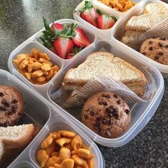 six plastic containers filled with different types of food and fruit on top of a table