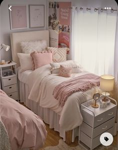 a bed room with a neatly made bed and two nightstands next to each other