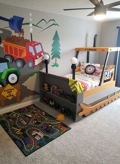 a child's bedroom with a train theme painted on the wall and carpeted floor