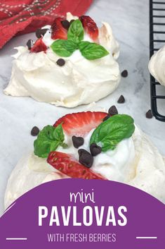 mini pavlovas with fresh berries and chocolate chips on top are ready to be eaten