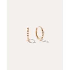 A new everyday favorite, these 14k gold beaded hoops look great dressed up or down. Gold Hoop Earrings With Tiny Beads, Trendy Everyday Jewelry With Gold Beads, Gold Hoop Jewelry With Tiny Beads, Elegant Everyday Hoop Earrings With Round Beads, Elegant Small Hoop Earrings With Gold Beads, Everyday Gold Beaded Hoop Earrings, Everyday Hoop Earrings With Tiny Beads, Everyday Beaded 14k Gold Jewelry, Everyday 14k Gold Beaded Jewelry