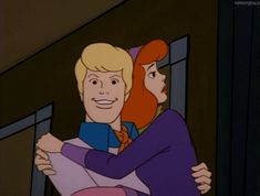 an image of a man and woman hugging each other in the middle of a cartoon