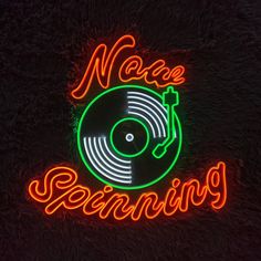 neon sign with vinyl record player and name