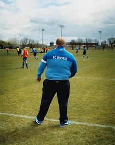 a man standing on top of a soccer field