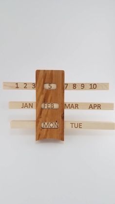 three pieces of wood with words on them