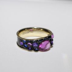 14K yellow gold ring with blue, pink and violet sapphires (20 pc. t.w. 2.94 ct)Smooth cabochons look like raindrops reflecting a rainbow - yes, we are that romantic))Highly unusual ring great both with jeans and evening wearIf your size is not in stock, please order and state the desired size in the comment to your order and allow two weeks for production. Yellow Gold Multi-stone Cabochons For Fine Jewelry, Yellow Gold Multi-stone Cabochons Fine Jewelry, Yellow Gold Multi-stone Cabochons For Gift, Purple Multi-stone Sapphire Ring, Rainbow Waterfall, Unusual Rings, Yellow Gold Ring, Multi Stone Ring, A Rainbow