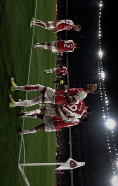 the soccer players are lined up on the field