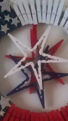 red, white and blue stars are arranged in the shape of a star