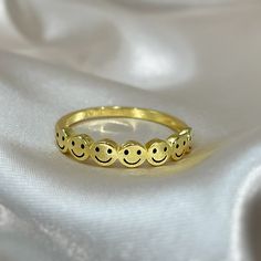 This unique ring is made of 18K Gold Vermeil decorated with a row of smily faces :)  Enjoy this ring stacked with other rings or on its own! A fun addition to your jewelry collection! MATERIALS > STERLING SILVER > 18K GOLD VERMEIL * C A R E INSTRUCTIONS * ~ Simple instructions to care for the jewelry is not expose to chemicals like bleach, chlorine, hairspray, to avoid chemical reactions or breakdown of materials. (Just as you would with any jewelry) ~ Try not wear your jewelry in the shower or Smile Ring, Face Ring, Stackable Bands, Chemical Reactions, Minimalist Bracelet, Unique Ring, Ring Dainty, Gold Polish, Opal Necklace