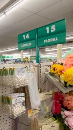 flowers and candles are on display in the store for $ 15 per pound or less