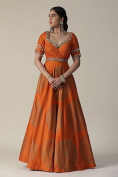 Burnt orange anarkali featuring foil printed mandala motifs, pleated bodice embellished by sequins and shell tassels. Comes with fringe lace lined dupatta. - Aza Fashions Orange Chanderi Sharara For Reception, Orange Anarkali Set For Reception And Festivals, Chanderi Choli In Orange For Receptions, Orange Chanderi Choli For Reception, Orange Chanderi Dupatta For Reception, Orange Art Silk Traditional Wear For Reception, Reception Orange Art Silk Traditional Wear, Orange Traditional Wear For Diwali Reception, Orange Traditional Wear For Reception And Diwali