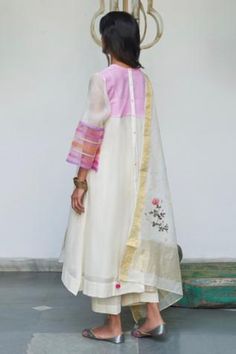 Ivory kurta with ditsy embroidery and round neck. Paired with inner slip, pants and dupatta.
Component: 4
Embroidered
Neckline: Round
Sleeve Length: Three Quarter
Fabric: Kurta and Dupatta: Chanderi; Pants: Cotton
Color: White
Contrast hem sleeves
Button placket at the back
Embroidered dupatta with tassels - Aza Fashions Ditsy Embroidery, Appliqué Flowers, Kurta And Dupatta, Blouse Yoke, Kurta Cotton, White Kurta, Ivory Fabric, Cotton Slip, Cotton Kurta